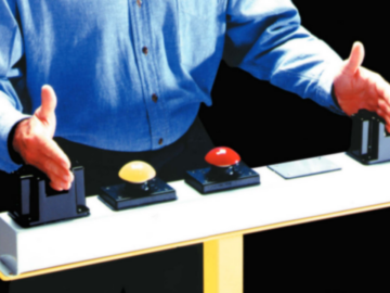 Operator using an ergonomic palm button in an industrial setting, demonstrating safe two-hand control for machinery operation.