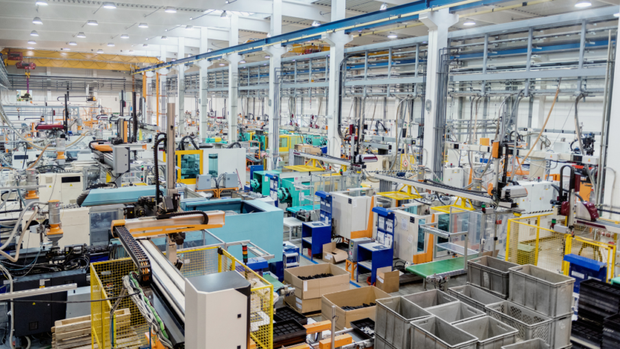 Machine shop floor with safety mats placed around heavy machinery, enhancing worker safety and preventing accidents in a high-risk industrial environment.