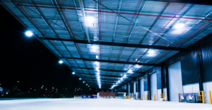 Close-up of safety light curtains installed around robotic machinery, creating an invisible barrier to detect breaches and stop operations instantly.