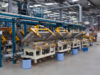 Industrial machine floor equipped with safety guarding solutions, including safety mats and light curtains, ensuring worker protection and regulatory compliance.